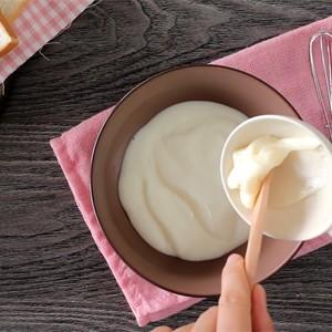 Add yogurt, condensed milk and mayonnaise into a bowl