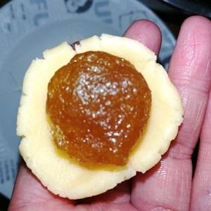place the small round piece of pineapple jam