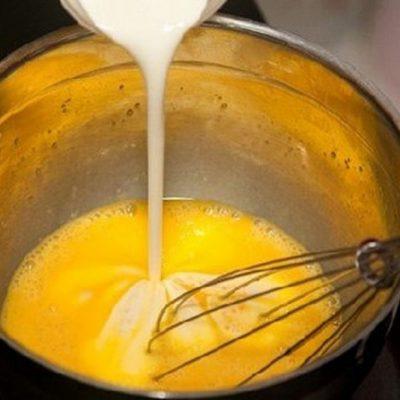 Place the egg yolks, fresh milk, condensed milk and vanilla in a large bowl, stir and sieve