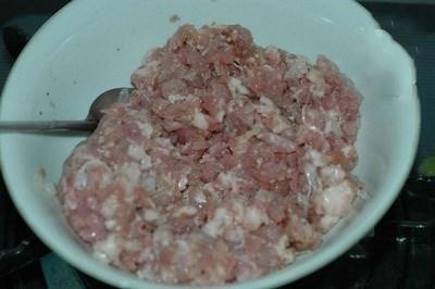 put ground pork meat into a bowl