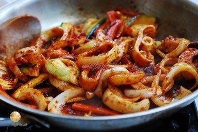 add squid pieces into pan and stir-fry