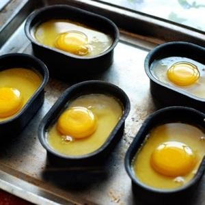 beat chicken egg into each mold