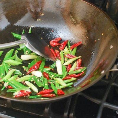 stir-fry chilis and green onion